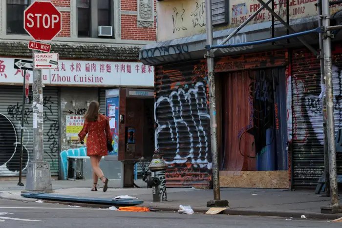 A photo of a woman walking on the Lower East Side